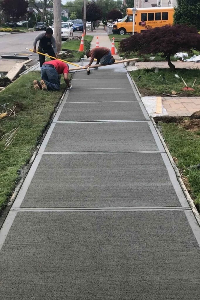 NYC DOT sidewalk violation repair in Manhattan — sidewalk construction and repairs